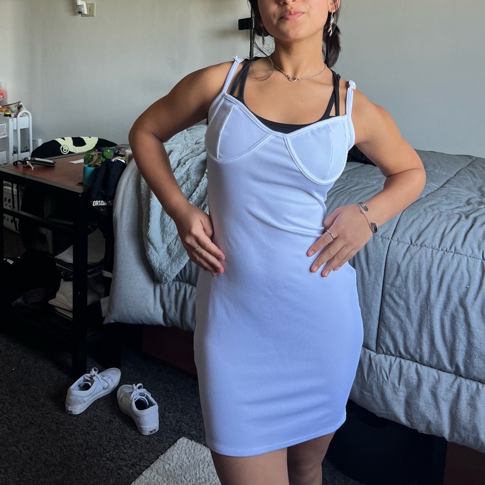Body con, white dress from a boutique.